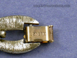 Signed Lisner on foldover clasp